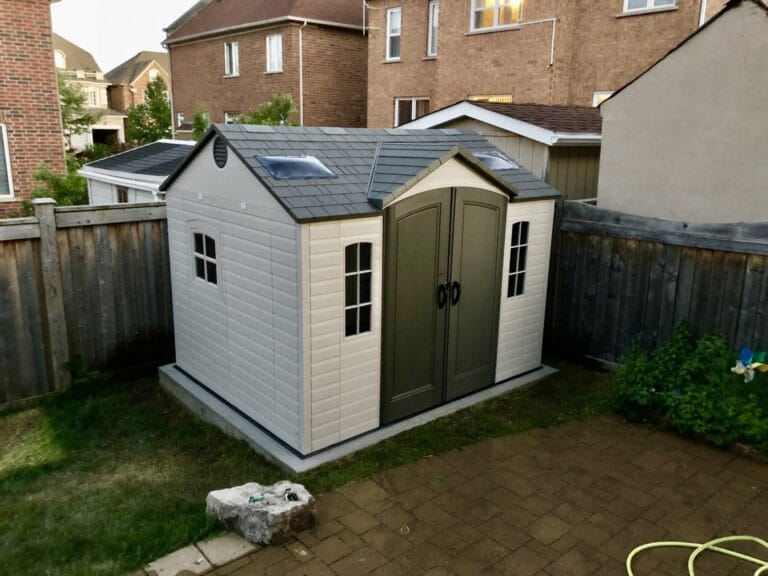 Double-door storage shed installation Toronto