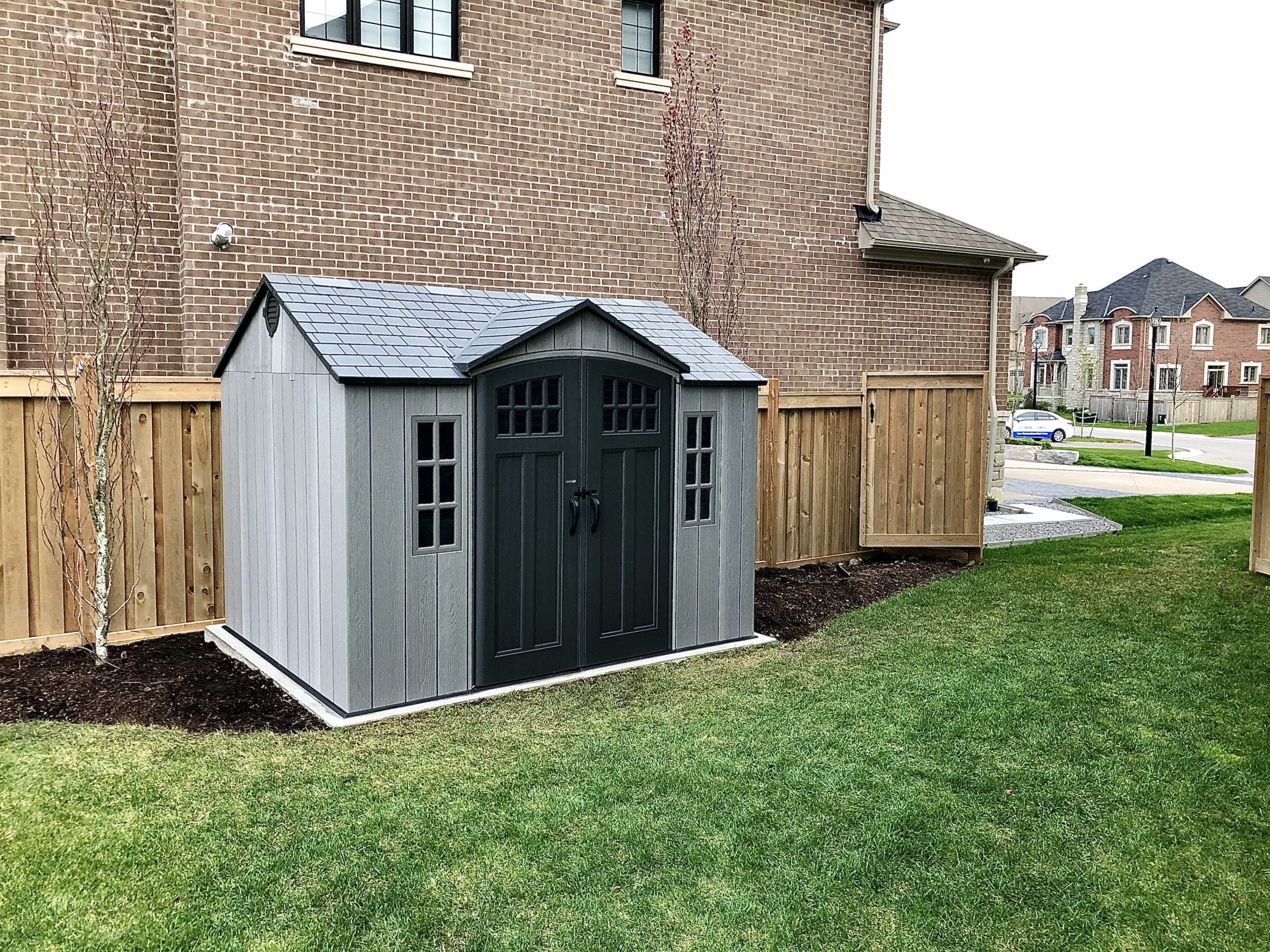 Lifetime 10' x 8' outdoor garden shed installation in Toronto backyard.